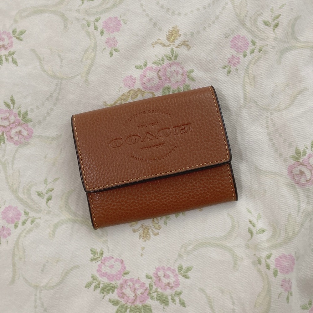 Coach coin case in saddle color